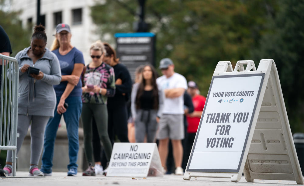 People wait in line to vote Saturday at Bank of America Stadium in Charlotte, N.C.