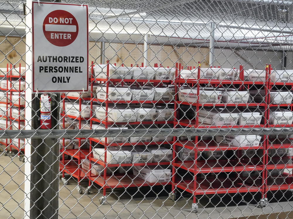 Mail-in ballots sit in a secure area of the Allegheny County Election Division warehouse in Pittsburgh on Nov. 3. Pennsylvania state law does not allow election officials to start processing mail ballots for counting until 7 a.m. ET on Election Day.