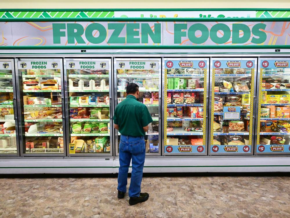 A man ponders the options at a Dollar Store in Alhambra, California. Shoppers continue to face high prices on everyday goods. Inflation is the top voter concern in the midterm elections.