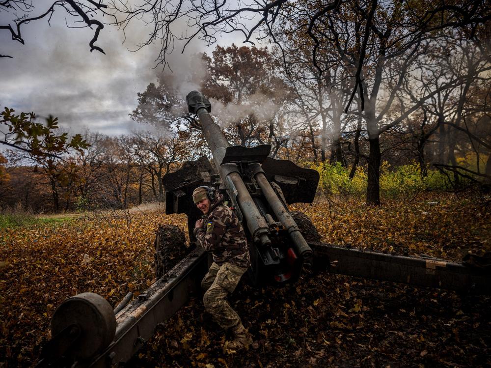 A Ukrainian artilleryman fires a howitzer at a position on the front line near Bakhmut, in eastern Ukraine's Donetsk region, on Oct. 31.