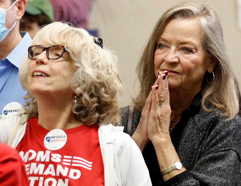 People listen to speakers during a rally for Democrats Monday in Henderson, Nev.