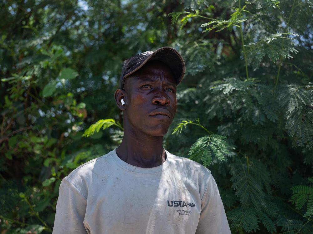 Sadio Konte Dior, 20, on the farm where he works outside of Dakar on October 4. He came to Senegal from Mali. On these small farms just outside of the capital, men and women who have migrated regionally grow lettuce and other vegetables.