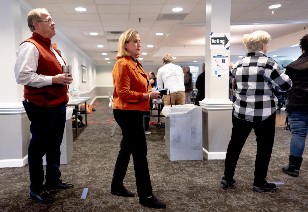 Republican U.S. Rep. Ann Wagner (MO-02) waits to cast her Midterm ballot alongside her husband Roy, left, on Tuesday, Nov. 8, 2022, at the Ballwin Golf Course and Events Center in Ballwin.