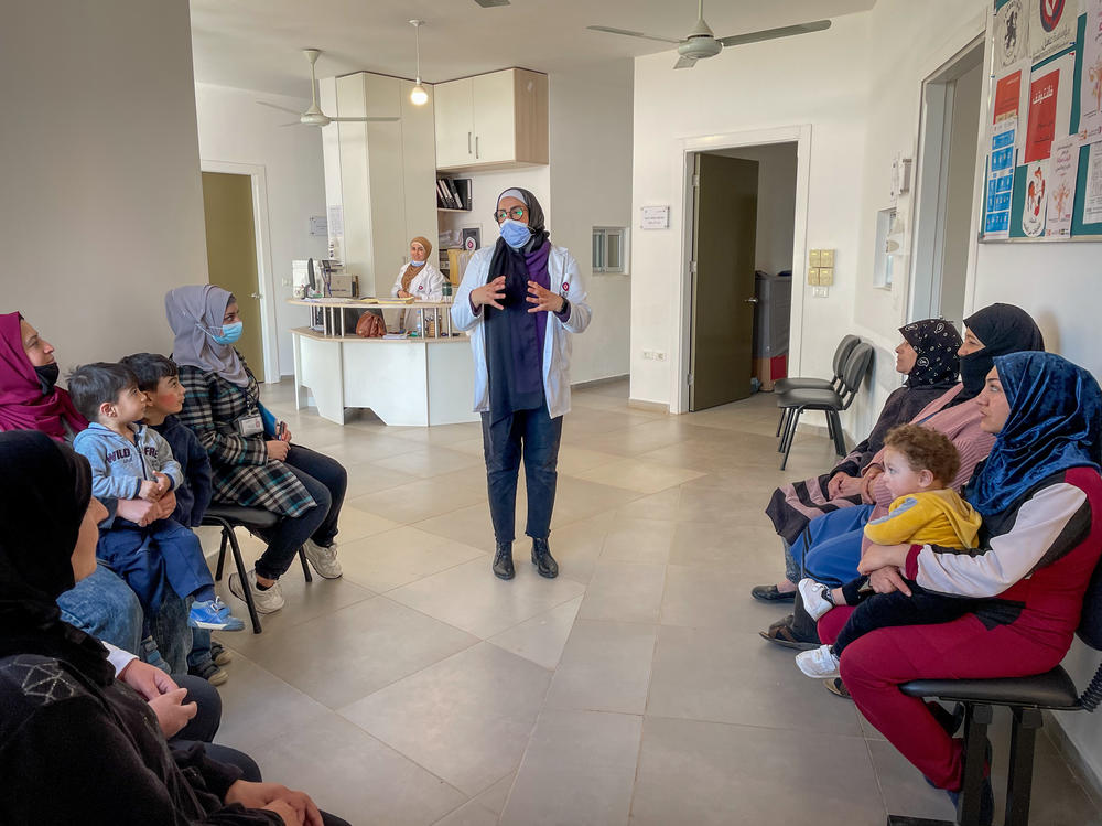 Al-Ahmar makes a daily announcement in the health center about how to avoid cholera, such as washing hands thoroughly and adding chlorine tablets to water.