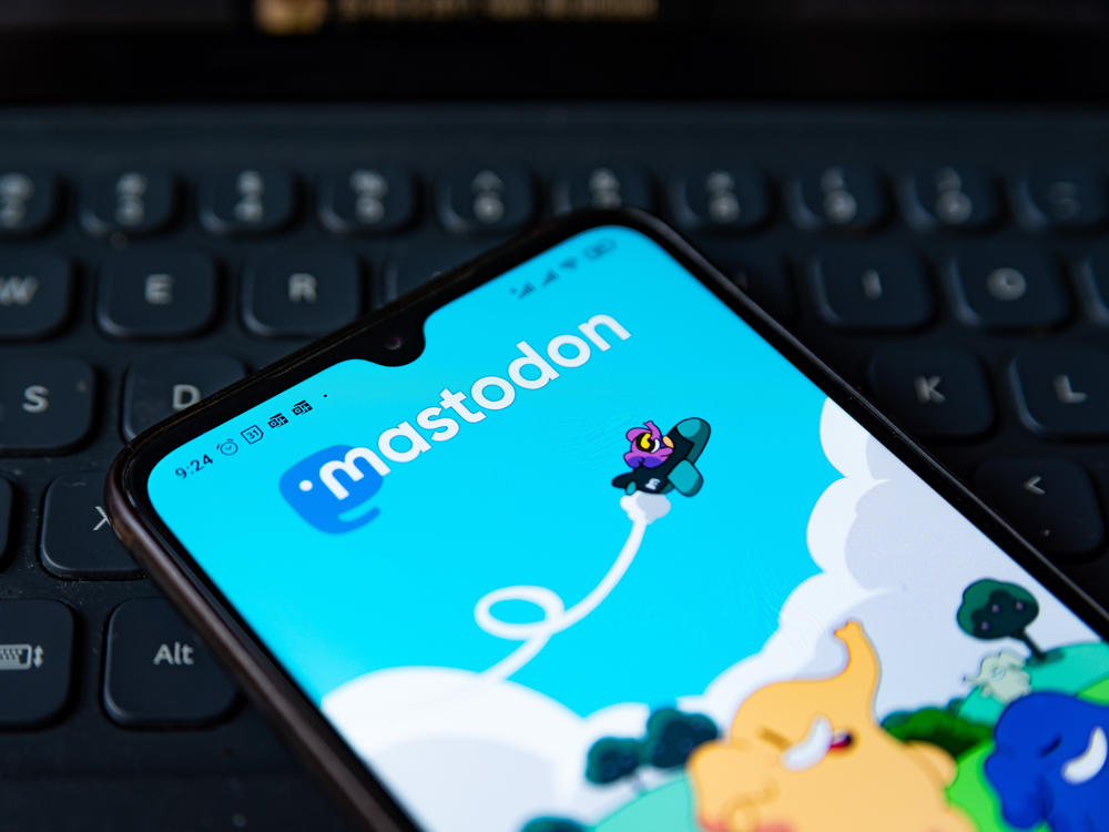 The Mastodon app homepage is seen displayed on a mobile phone screen.