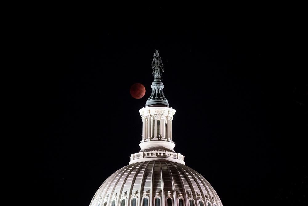The total lunar eclipse seen behind the U.S. Capitol dome on the morning of the midterm election.