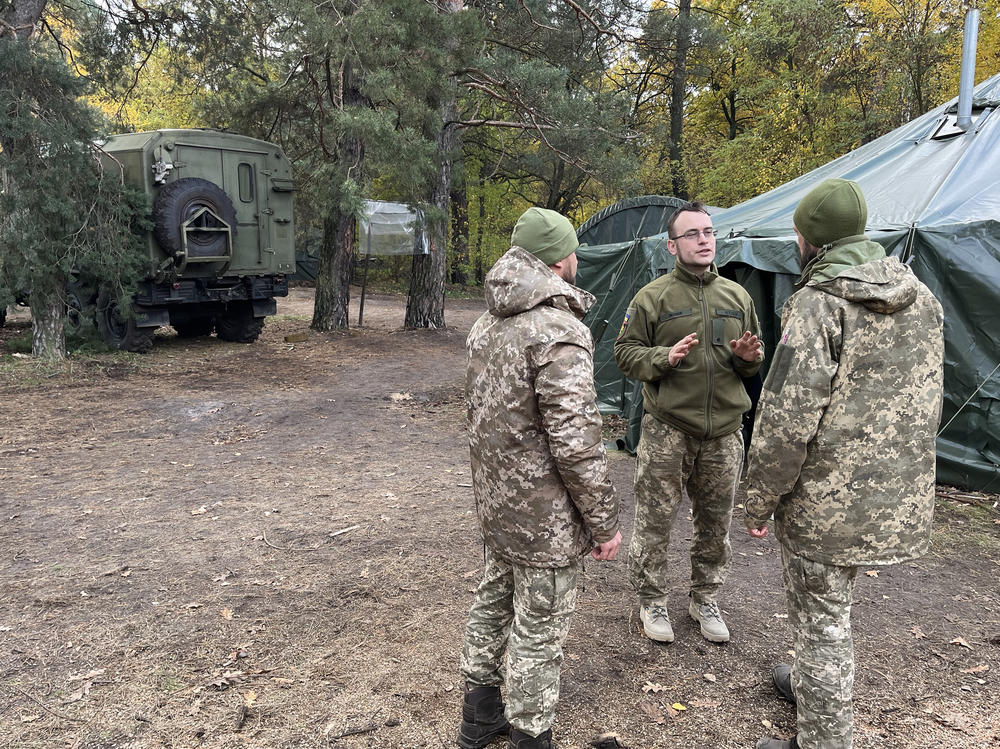 Lt. Anton Pendukh, a morale officer, speaks with fellow soldiers at a training camp outside Dnipro, Ukraine, on Oct. 24. He says he's tired, but has no choice but to fight.