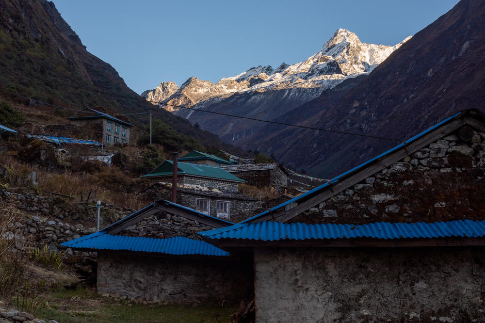 Many of the peaks near Beding have less snow and more bare rock than they used to because of global warming. They are a constant reminder of the changing climate for students and teachers at the town's monastery school.