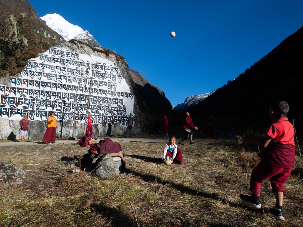 Students at the Rolwaling Sangag Choling Monastery School in Beding take a break to play volleyball in the afternoon sun.