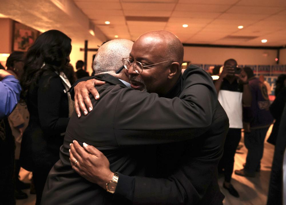 Glenn Ivey hugs his son, Alex Ivey.