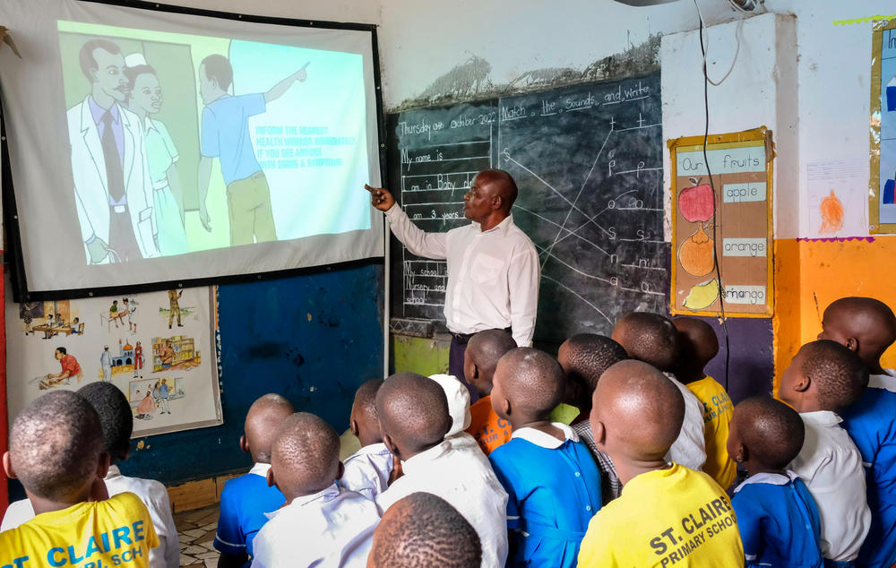 Students learn about Ebola in class at St. Claire Primary School in Kampala, Uganda. Schools will be closing early because of Ebola outbreak. Kids in Uganda have already missed two years of school due to the COVID-19 pandemic.