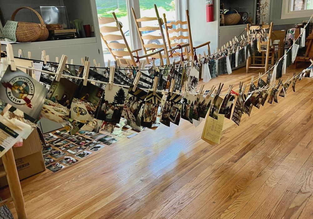 Photographs soaked by the flooding at Hindman Settlement School dry on clotheslines.