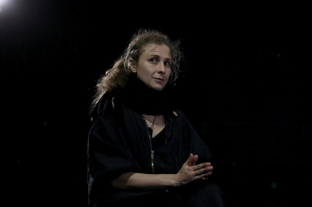 Maria Alyokhina speaks with media before performing at The Junction in Cambridge, England, on Nov. 2.