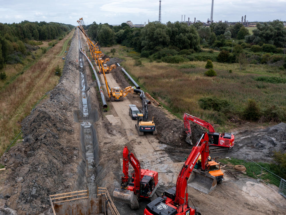 Workers in Germany construct a new pipeline for transporting natural gas imports from a nearby liquified natural gas facility. European countries are seeking new sources of natural gas, as they wean themselves off imports from Russia.