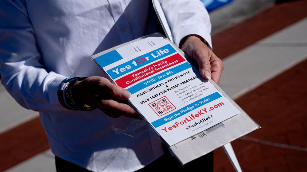 Kentucky Right to Life Executive Director Addia Wuchner displays a brochure urging voters to support Amendment 2, which would have stated that the state constitution contains no abortion protections.