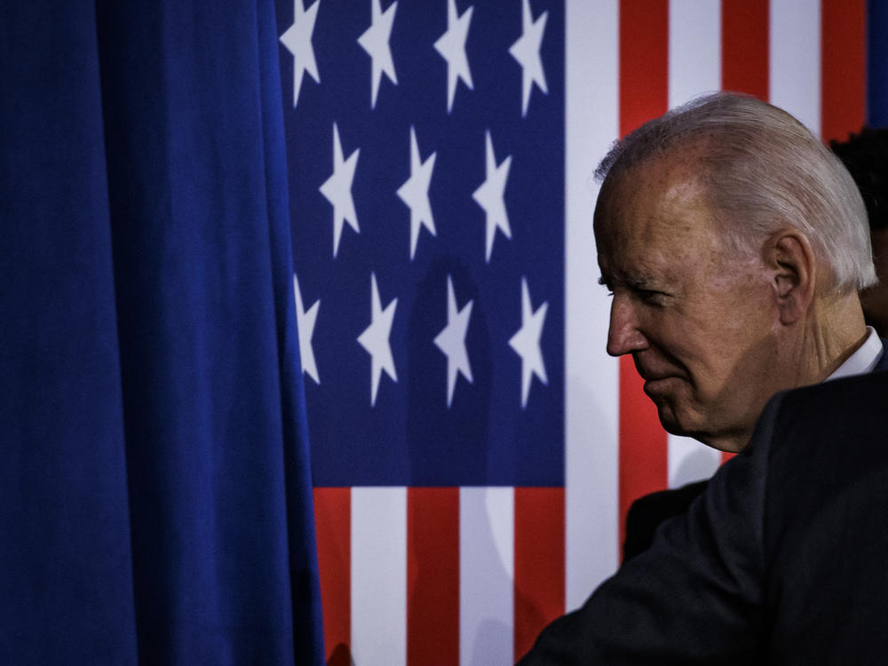 President Biden walks off stage after speaking at a rally to thank Democrats after the midterm election.