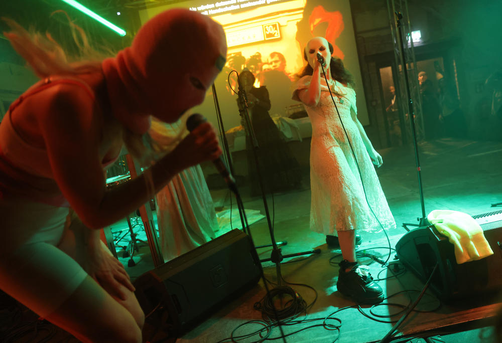 Diana Burkot, left, and Maria Alyokhina, right, perform Pussy Riot's theater piece 