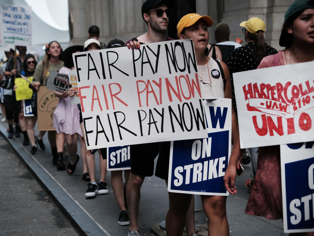 HarperCollins employees on a one-day strike earlier this summer. Workers have been in negotiations with the company since December 2021.