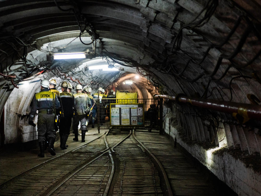 Workers at a coal mine in Ukraine start their shifts. Russia's invasion of Ukraine disrupted global supplies of fossil fuels and led to more reliance on coal for electricity in some countries.