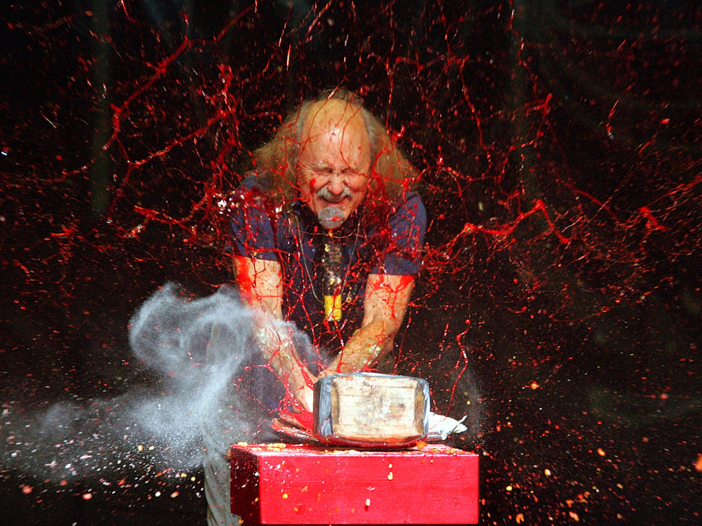 Comedian Gallagher smashes strawberry syrup and flour at the end of his performance at the Five Flags Theater in Dubuque, Iowa, on Nov. 18, 2006.