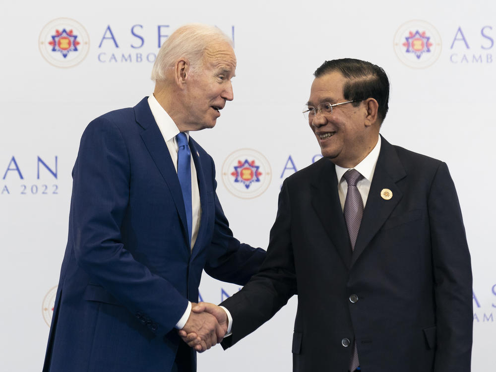 U.S. President Joe Biden shakes hands with Cambodian Prime Minister Hun Sen before their meeting during the Association of Southeast Asian Nations (ASEAN) summit on  Saturday in Phnom Penh, Cambodia.