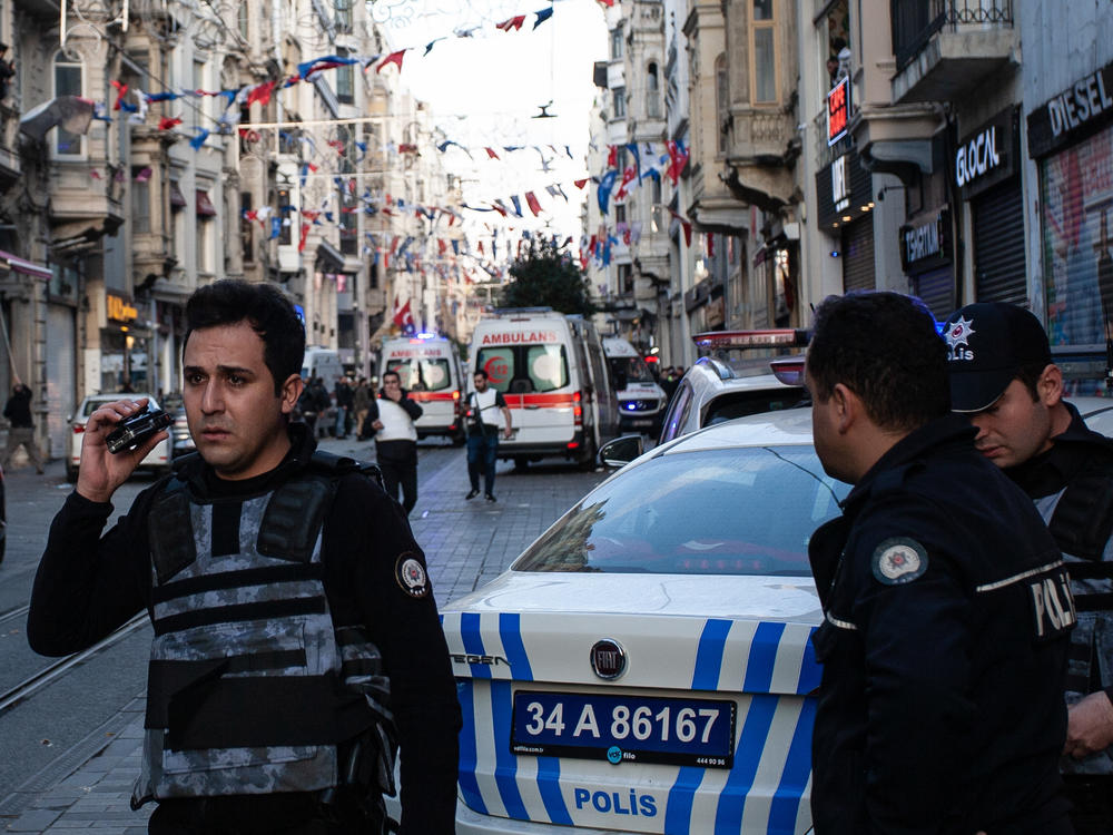 Emergency personnel investigate the scene of Sunday's deadly explosion that occurred on Istanbul's Istiklal Avenue, a busy pedestrian thoroughfare.
