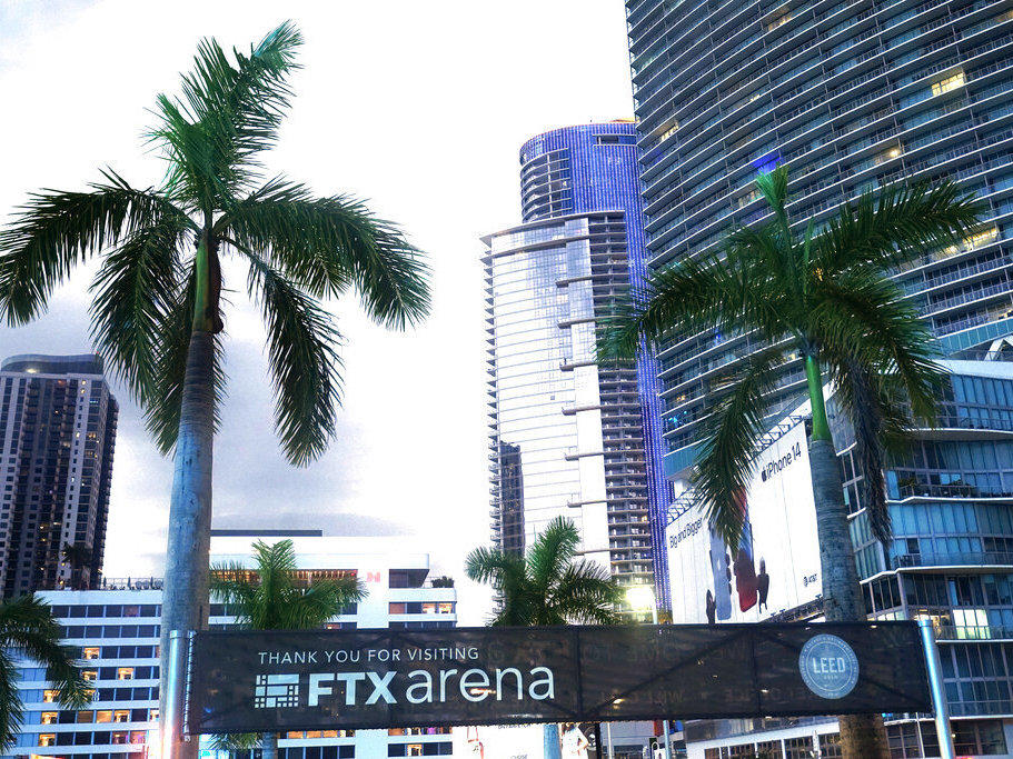 Signage for the FTX Arena, where the Miami Heat basketball team plays, is visible Saturday in Miami. Sam Bankman-Fried received numerous plaudits as the head of cryptocurrency exchange FTX: the savior of crypto, the newest force in Democratic politics and potentially the world's first trillionaire. Now the comments about the 30-year-old aren't so kind.