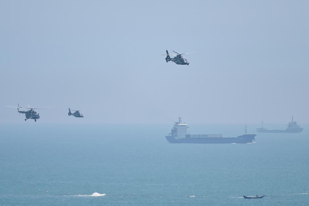 Chinese military helicopters fly past Pingtan island, one of mainland China's closest points to Taiwan, on Aug. 4, following House Speaker Nancy Pelosi's visit to the self-ruled island.