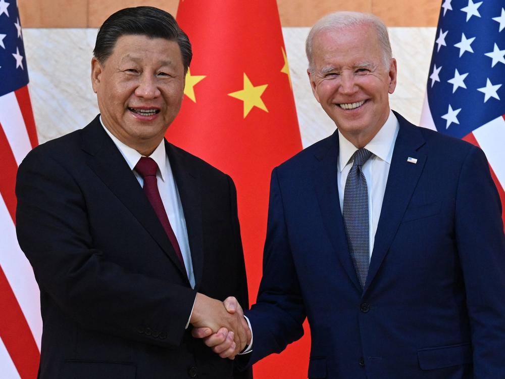 President Biden and China's President Xi Jinping shake hands as they begin talks in Bali.