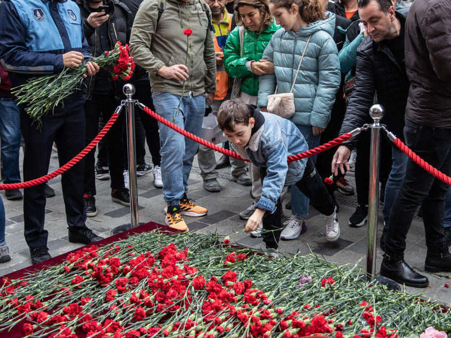 On Monday, people lay flowers to pay tribute to the victims of a Sunday's blast that took place on Istanbul's famous Istiklal Avenue in Istanbul, Turkey.
