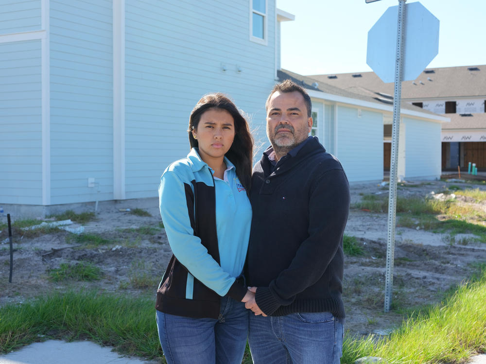 Paulo Echeverry and Dahianara Lopez Zapata, at the development site where the new home they agreed to buy is under construction and nearly finished.