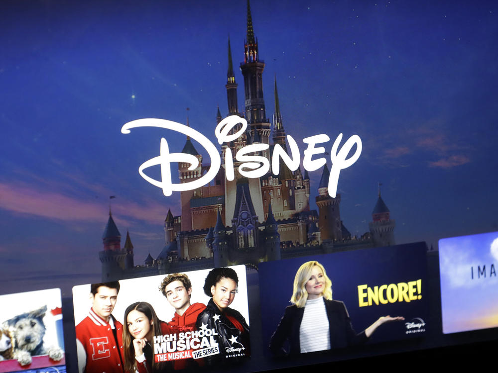 In this Wednesday, Nov. 13, 2019, file photo, a Disney logo forms part of a menu for the Disney Plus movie and entertainment streaming service on a computer screen in Walpole, Mass.