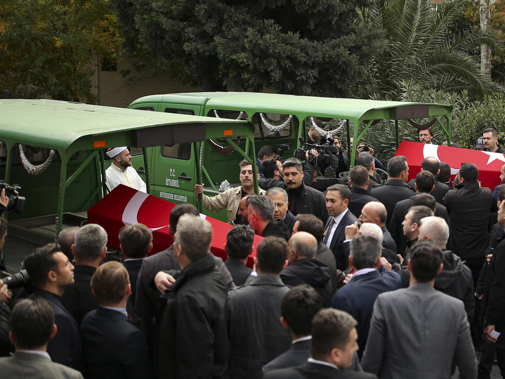 Relatives and friends of Arzu Ozsoy and her 15-year-old daughter Yagmur Ucar, who died in Sunday's explosion occurred on Istiklal avenue, attend their funeral in Istanbul, Turkey, Monday, Nov. 14, 2022.