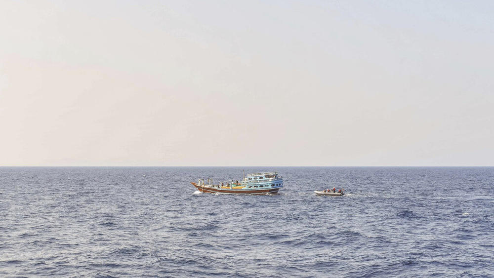 Sailors intercept a dhow Nov. 8 in the Gulf of Oman. The U.S. Navy says it found 70 tons of a missile fuel component hidden among bags of fertilizer aboard the ship, which was bound for Yemen from Iran. It's the first such seizure in Yemen's yearslong war, as a ceasefire there has broken down.