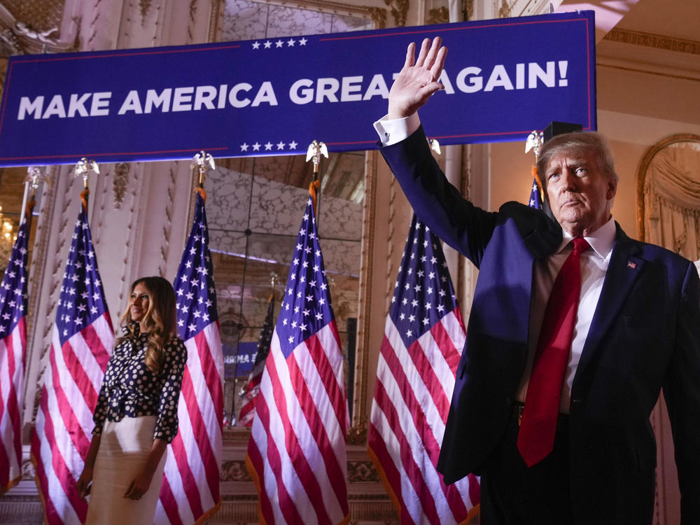Former President Donald Trump waves after announcing he is running for president for the third time, on Nov. 15, 2022.