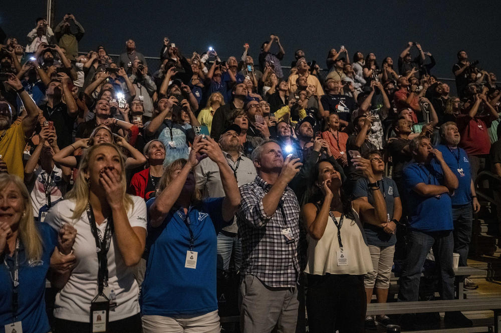 Guests at the Banana Creek watch the launch of NASA's Space Launch System rocket carrying the Orion spacecraft on the Artemis I flight test, early Wednesday, Nov. 16 at NASA's Kennedy Space Center in Fla.