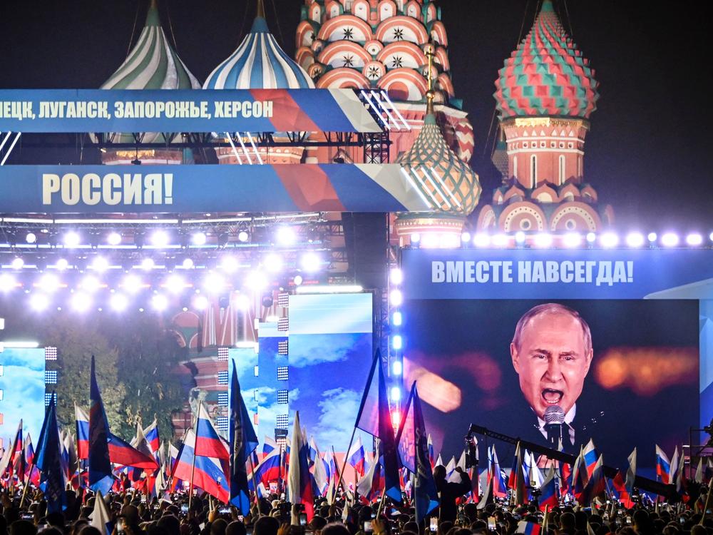 Russian President Vladimir Putin is seen on a screen set at Red Square in Moscow on Sept. 30, as he addresses a rally marking the annexation of four regions of Ukraine occupied by Russian troops: Lugansk, Donetsk, Kherson and Zaporizhzhia.