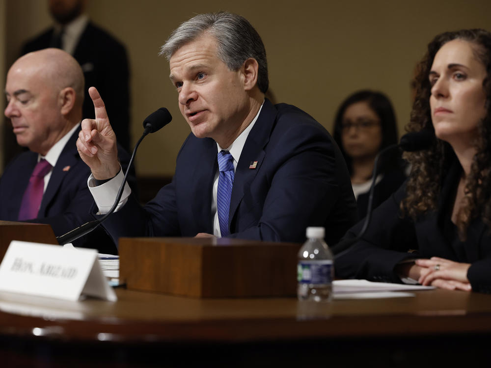 Federal Bureau of Investigation Director Christopher Wray testifies before the House Homeland Security Committee on Tuesday. Homeland Security Secretary Alejandro Mayorkas and National Counterterrorism Center Director Christine Abizaid were also there to discuss threats to the U.S.