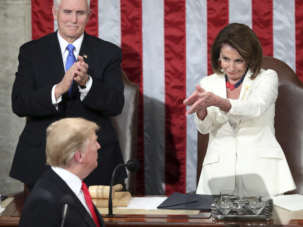 President Donald Trump turns to House Speaker Nancy Pelosi as he delivers his State of the Union on Feb. 5, 2019, as Vice President Mike Pence watches.