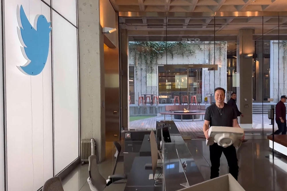A screenshot from a video posted on the Twitter account of Elon Musk on Oct. 26, 2022 shows himself carrying a sink as he enters the Twitter headquarters in San Francisco.