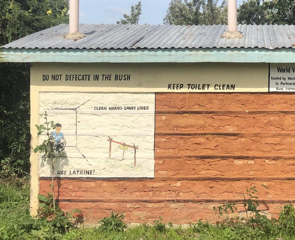 A sign in a Kenyan village urges people not to practice open defecation in the bush. About 673 million people openly defecate and the U.N. has called for 