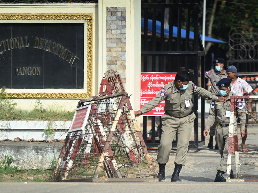 Prison security officials prepare for the release of inmates outside Insein prison in Yangon on November 17, 2022.