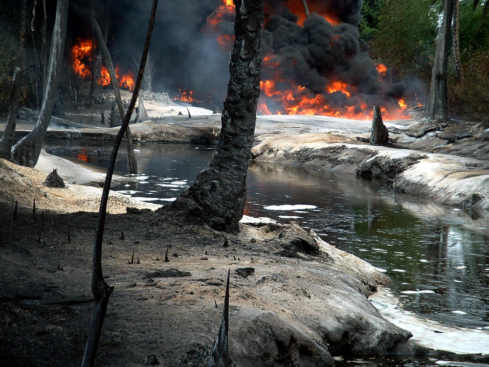 Oil from a leaking pipeline burns in Goi, a village in the Niger Delta in Nigeria. The spill came from Shell Nigeria's pipeline, and the ensuing fires burned through Goi and its mangroves. A local farmer came to attorney Chima Williams and asked: 