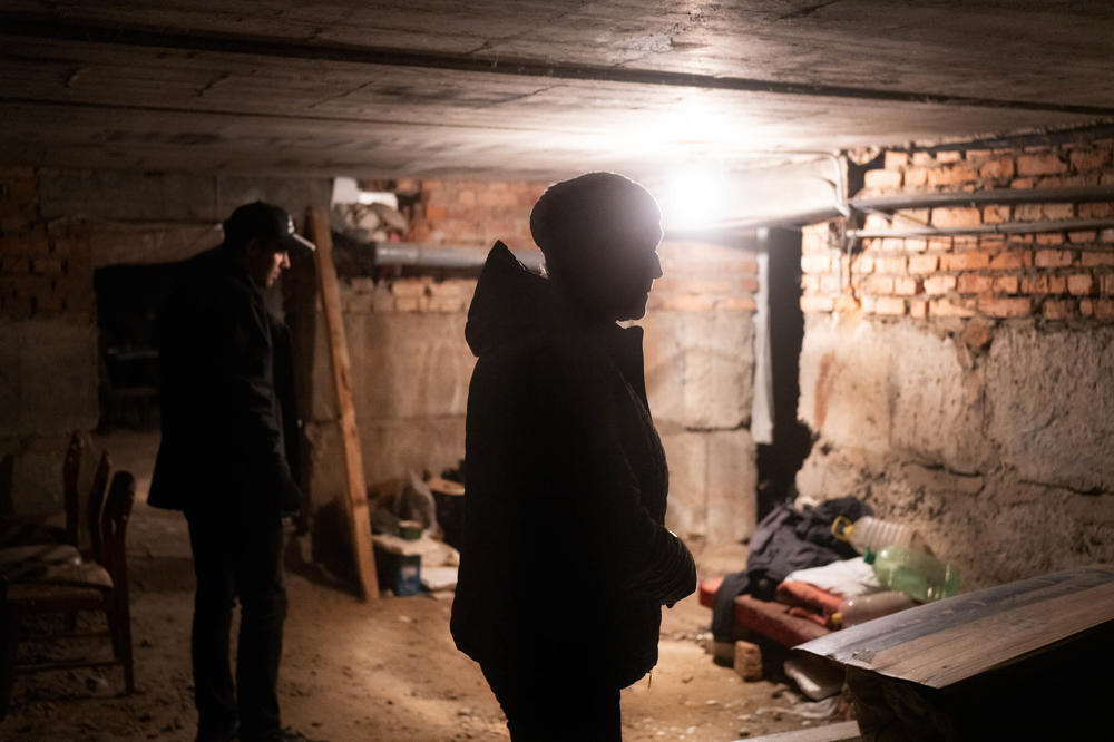 Zahorodnikh stands in the basement of her building where she sheltered while Izium was under Russian occupation.