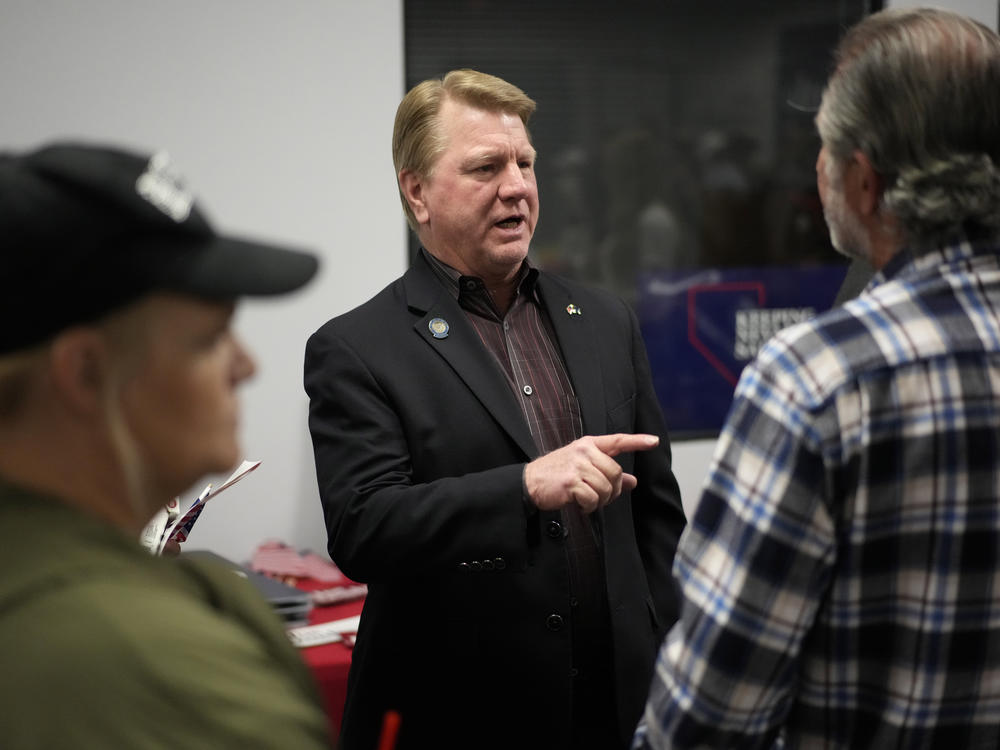 Jim Marchant, center, GOP nominee for secretary of state in Nevada, lost his election and also underperformed fellow Republicans running for U.S. senator and governor.