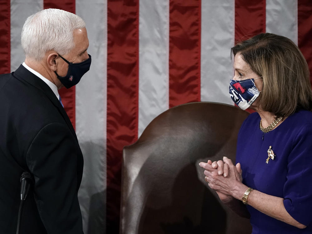 Speaker of the House Nancy Pelosi and Vice President Mike Pence talk during a joint session of Congress on Jan. 6, 2021 in Washington, D.C. Congress held a joint session today to ratify President-elect Joe Biden's 306-232 Electoral College win over President Donald Trump.