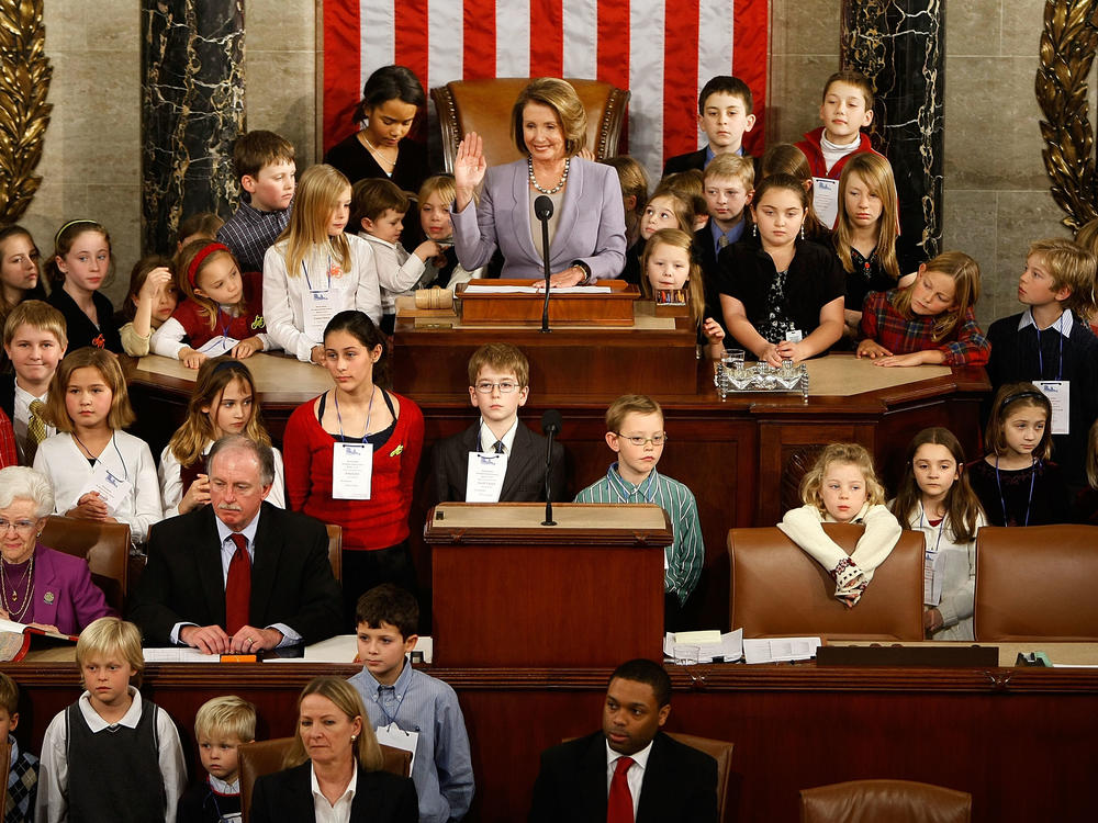 Speaker of the House Nancy Pelosi is sworn in as speaker while surrounded by her own grandchildren and the children of members of Congress during the first session of the 111th Congress on Jan. 6, 2009.