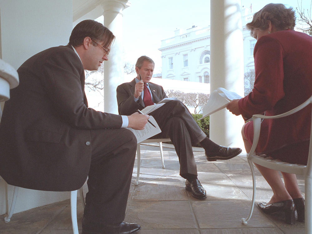 President George W. Bush prepares for his State of the Union Speech with Karen Hughes, Counselor to the President, and Michael Gerson, Director of Presidential Speech Writing, outside the Oval Office January 29, 2002 in Washington DC.