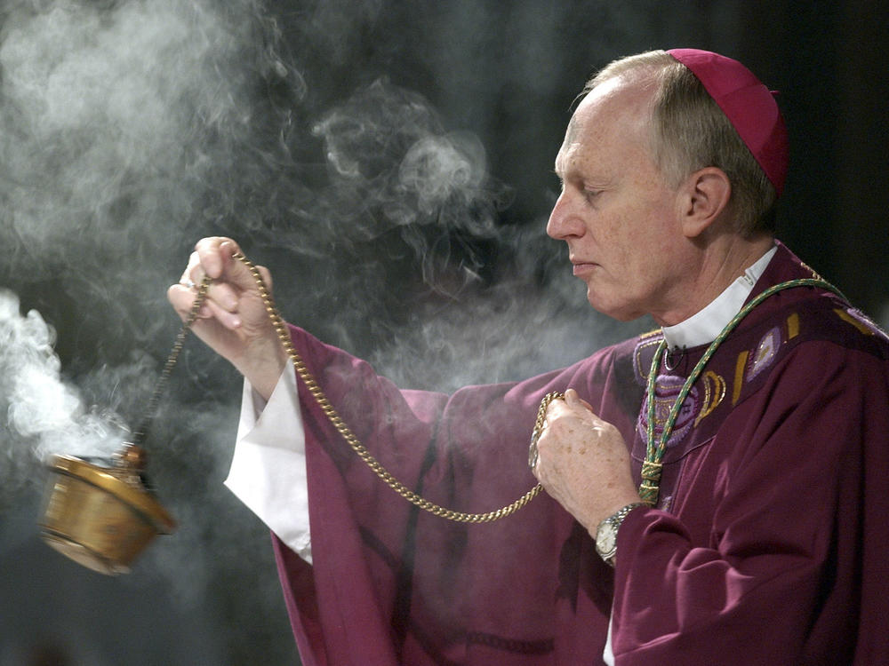 In this file photo, Bishop Howard Hubbard swings incense during an Ash Wednesday communion service at the Cathedral of the Immaculate Conception on Feb. 25, 2004, in Albany, N.Y.