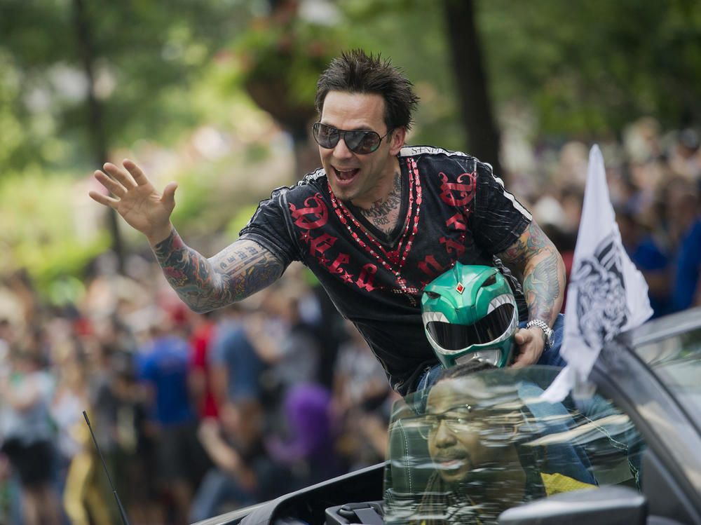 Jason David Frank, pictured waving to the crowd during the 2013 DragonCon parade through downtown Atlanta, has died. The 49-year-old played the Green Power Ranger Tommy Oliver on the 1990s children's series 